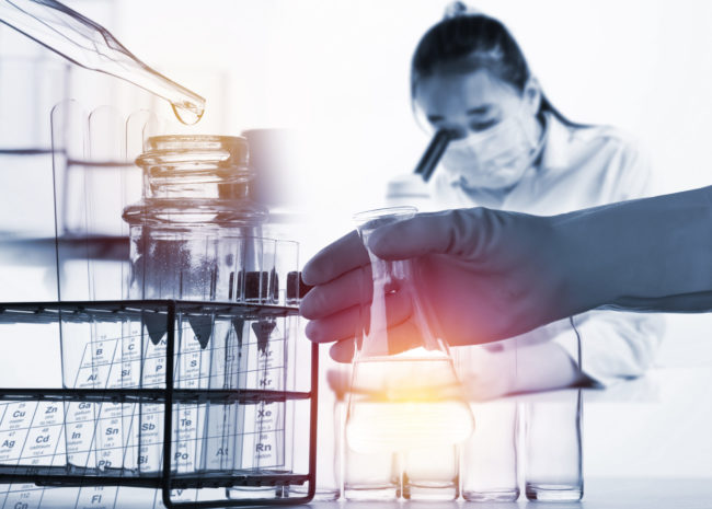 A,Beautiful,Female,Medical,Or,Scientific,Researcher,Using,Her,Microscope